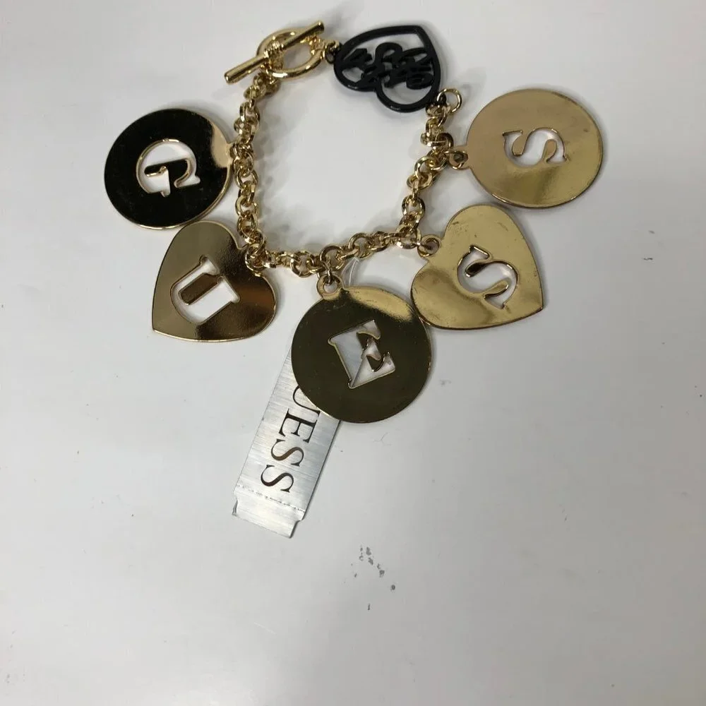 GUESS GOLD TONE LETTER CHARMS 7